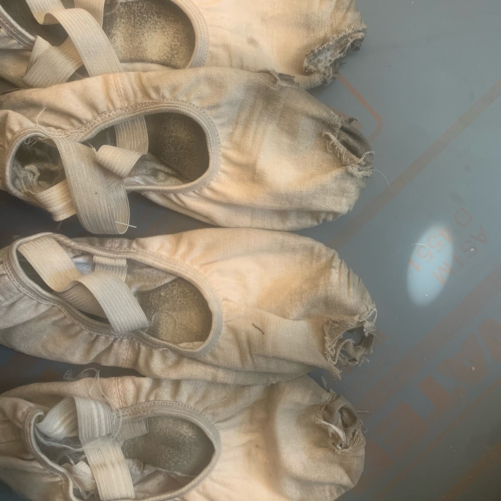 very worn ballet flats